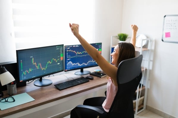yes-i-did-it-successful-stock-broker-made-good-business-deal-online-excited-freelance-woman-buying-stocks-and-celebrating-victory-at-work